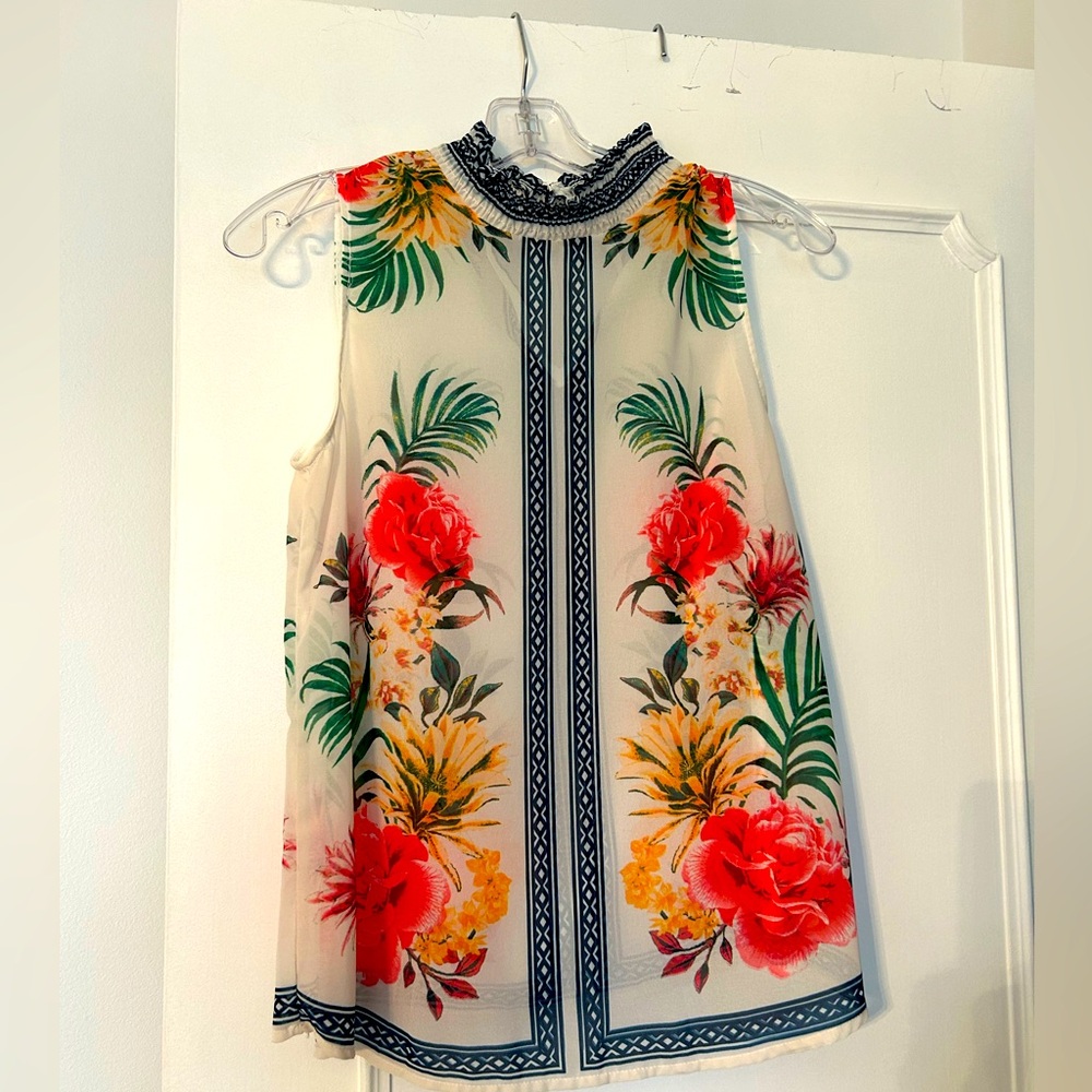 Floral ruffled neck sleeveless blouse